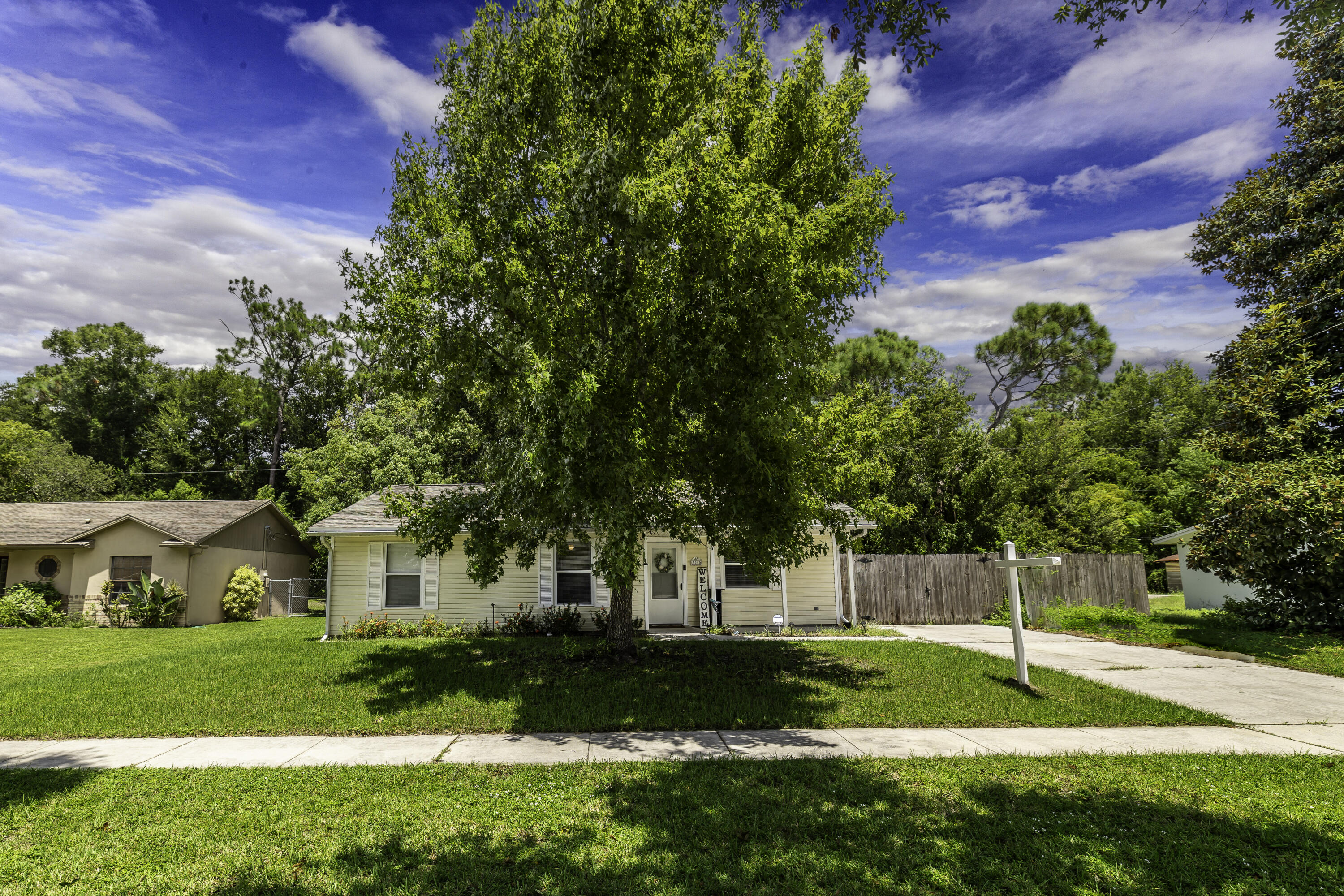 a view of a house with a yard