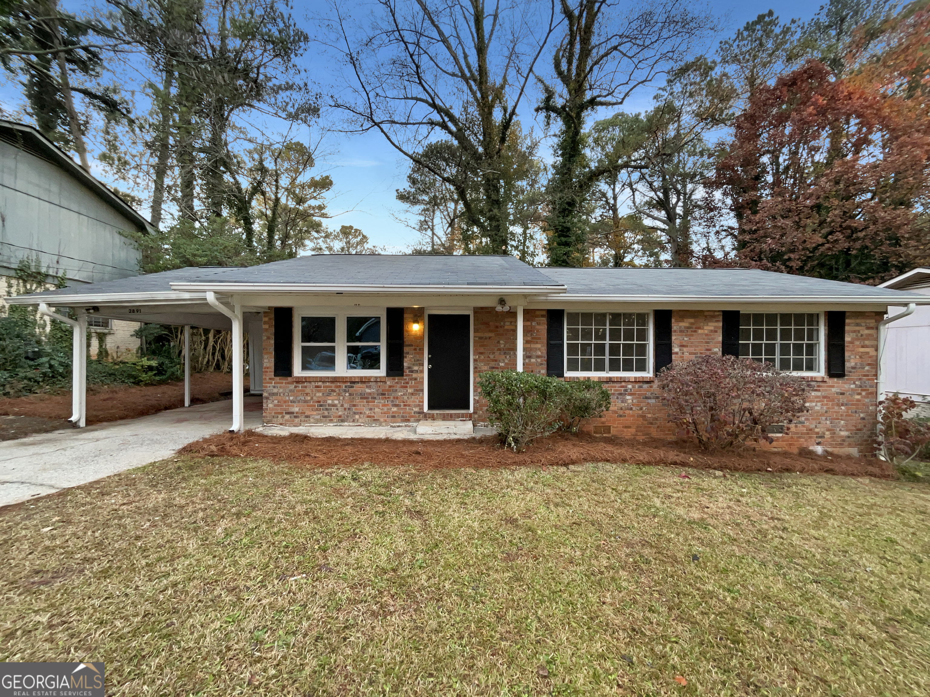 front view of a house with a yard