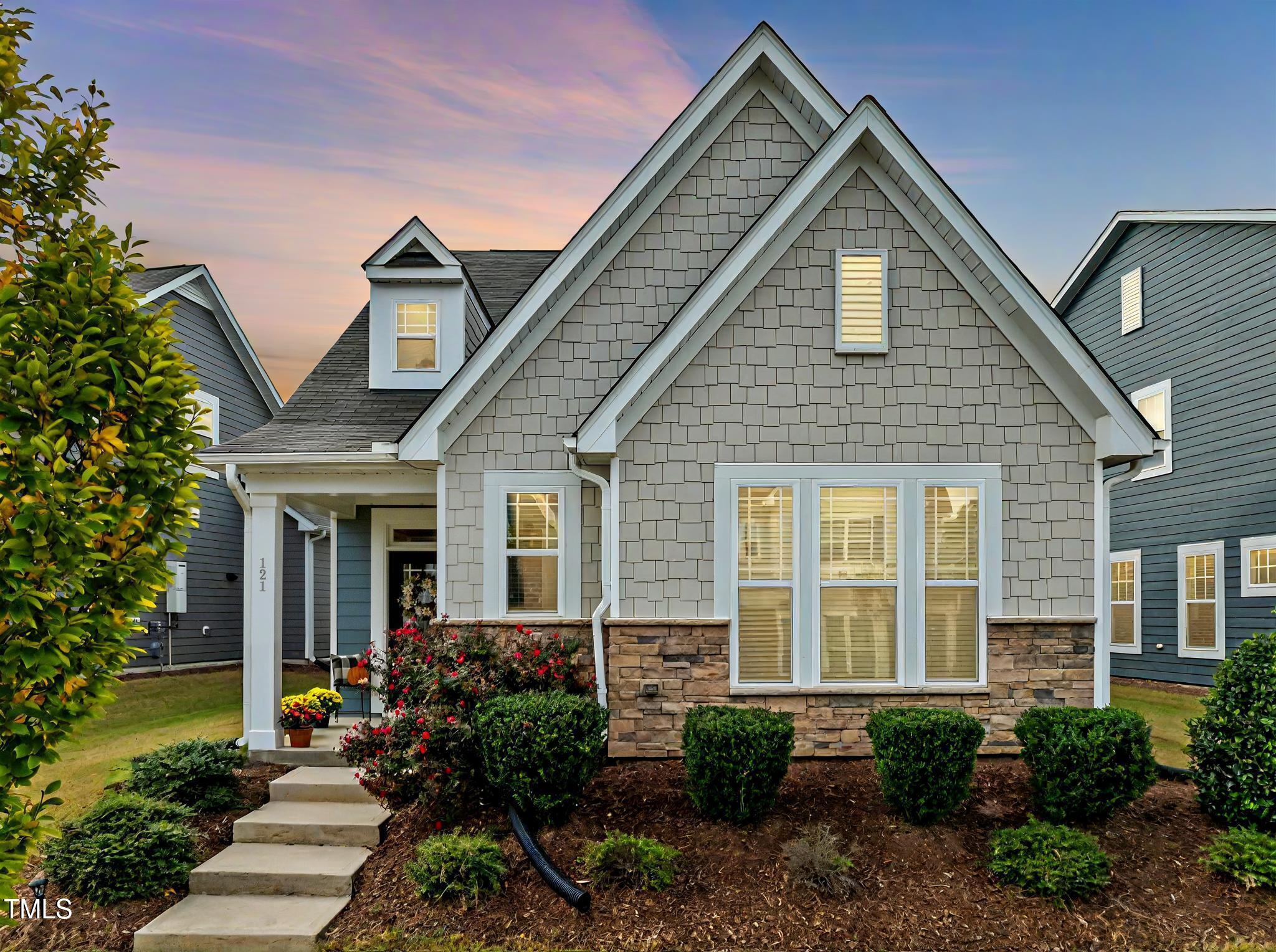 a front view of a house with garden