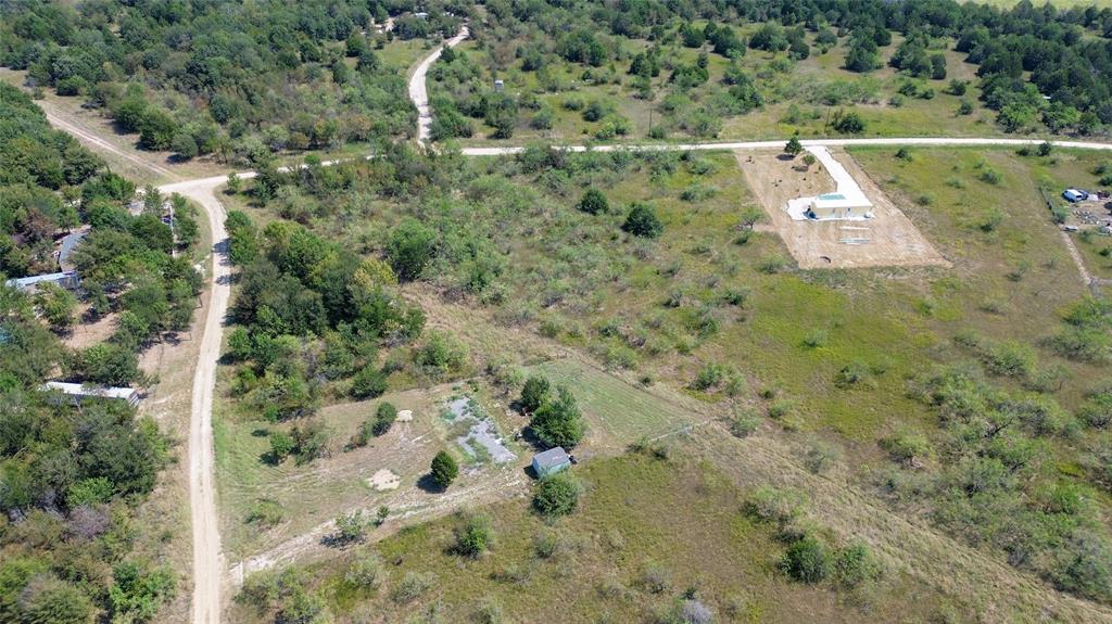 an aerial view of a residential houses with outdoor space