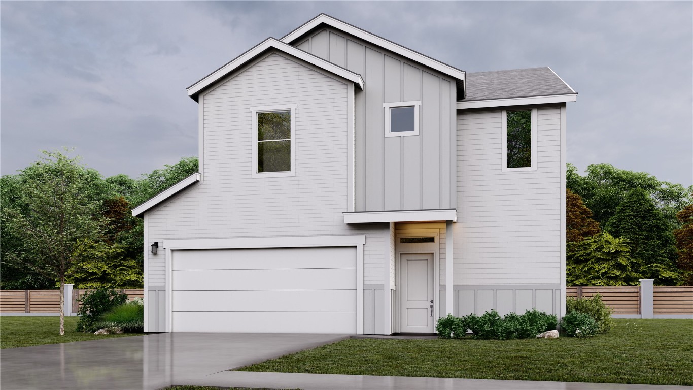 a view of a house with a yard and garage