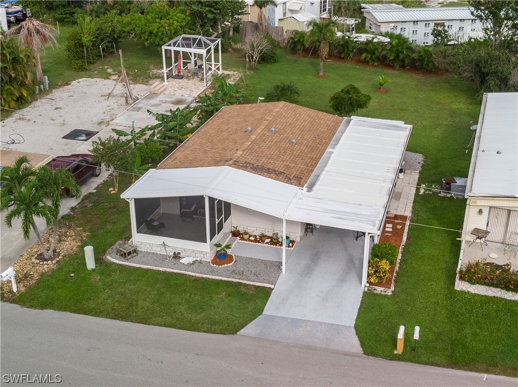 an aerial view of a house with a yard