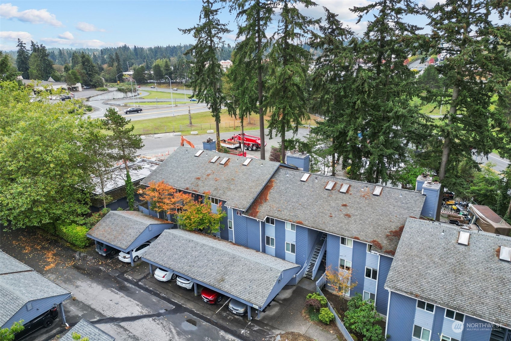 an aerial view of a house with a yard swimming pool and outdoor seating