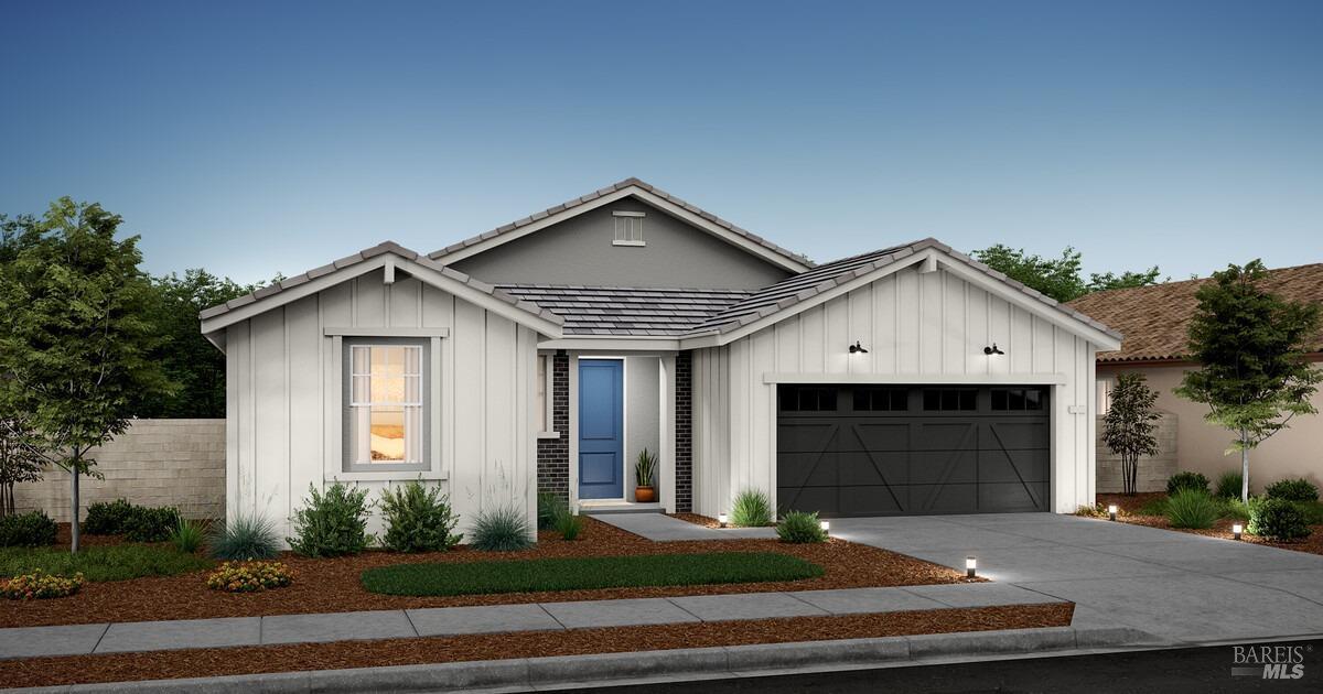 a front view of a house with garage