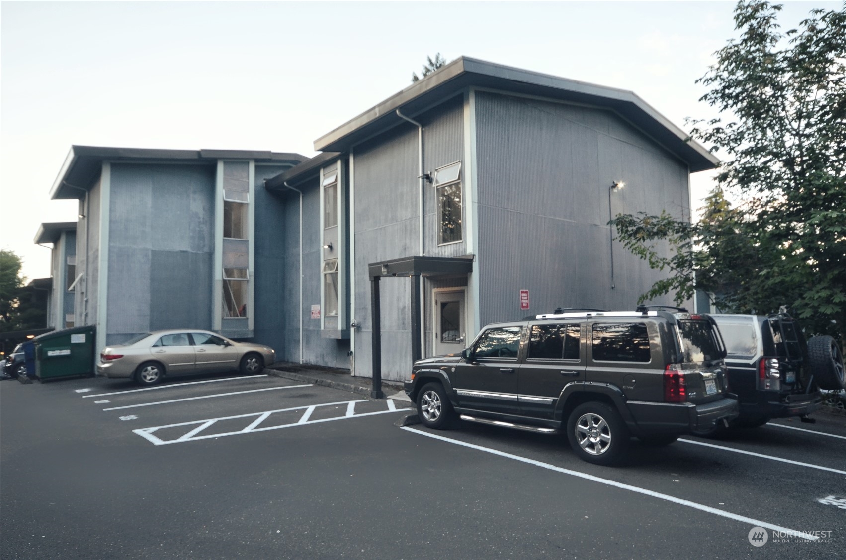 a view of a car parked in front of a house