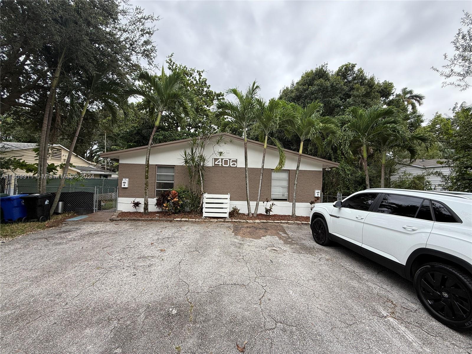 a view of a cars park in front of house