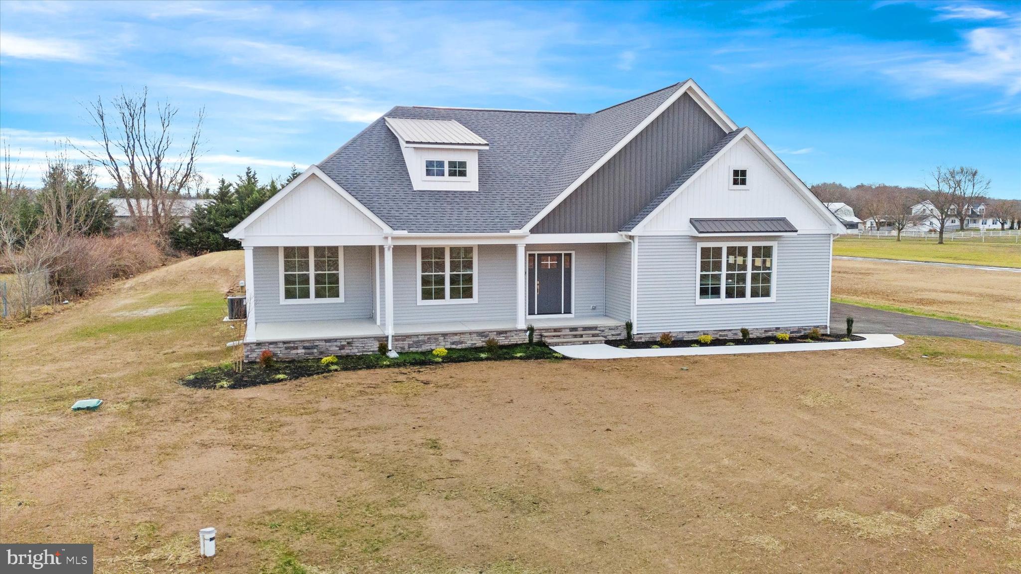 front view of a house with a yard