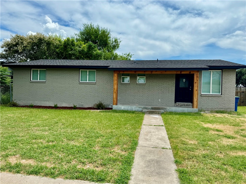 front view of a house with a yard