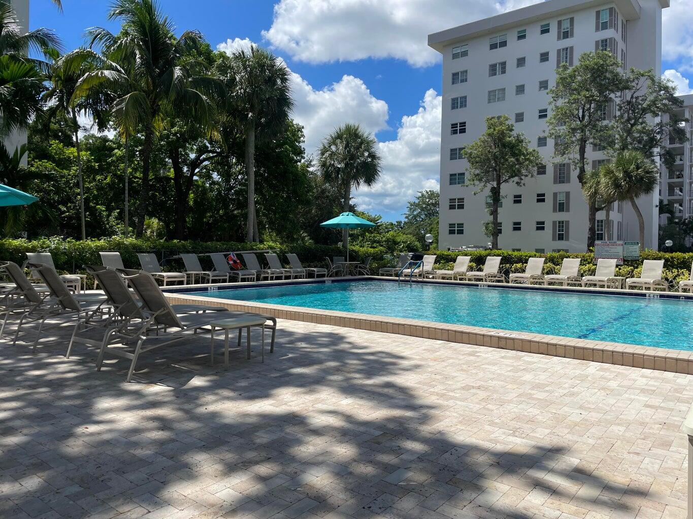 a view of swimming pool with a yard