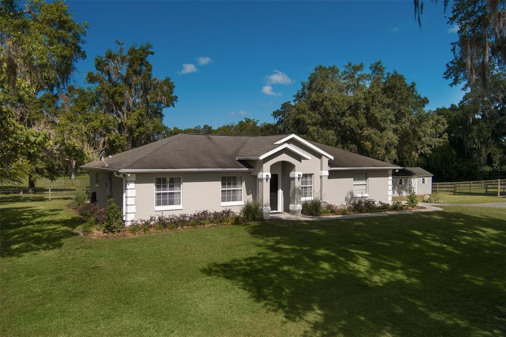 a front view of a house with a yard