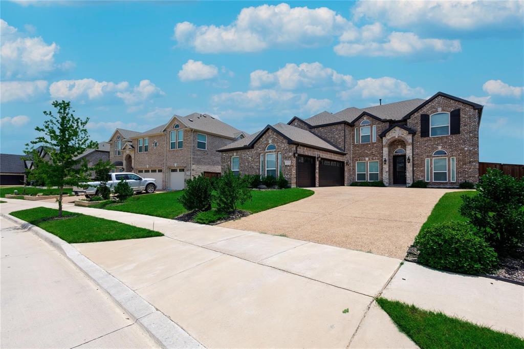 a front view of a house with yard