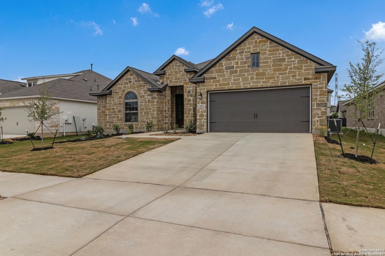 a front view of a house with a yard