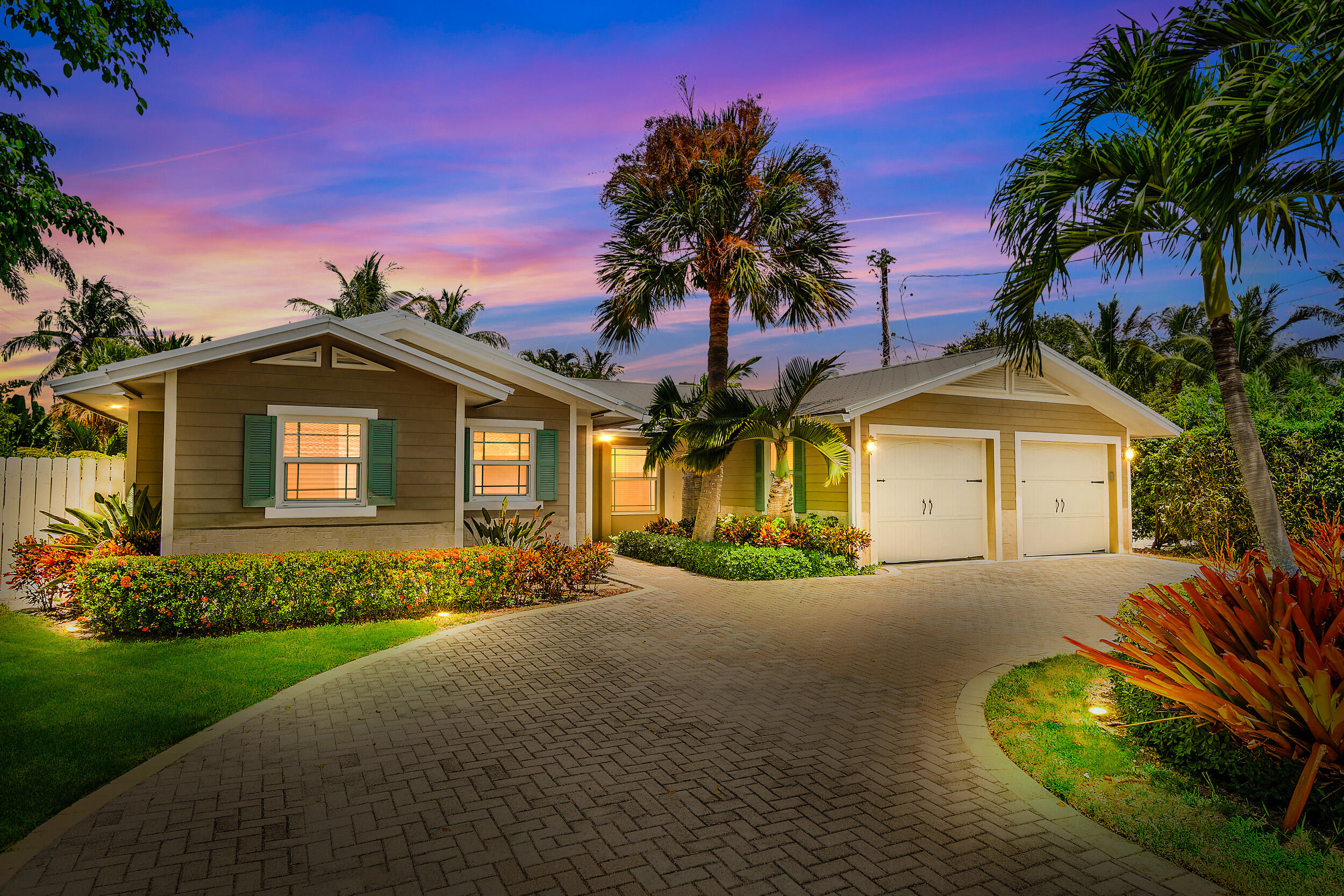 a view of a house with palm trees