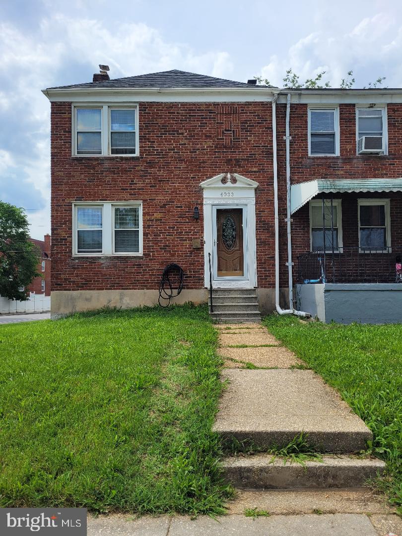 front view of a house with a yard