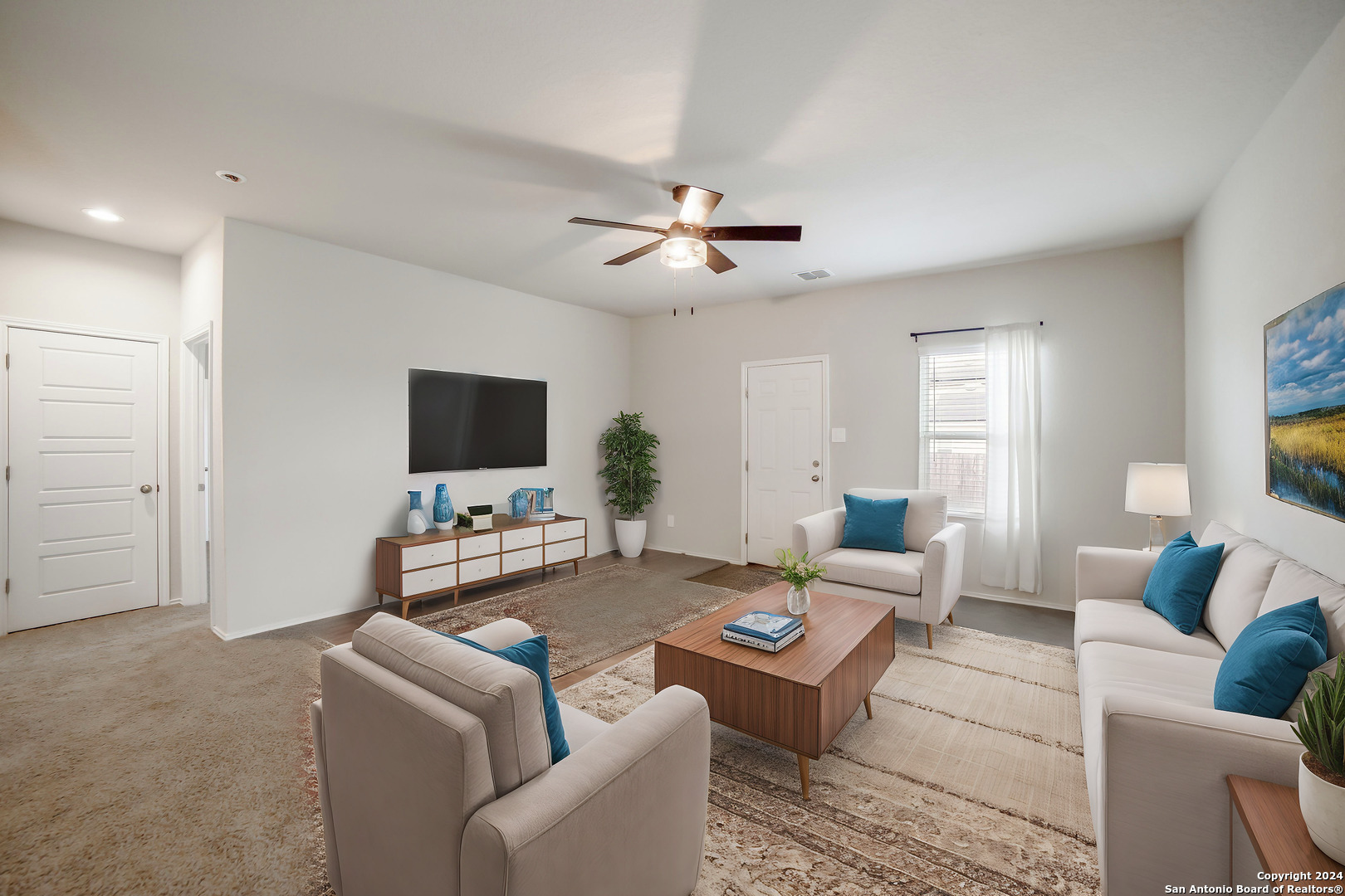 a living room with furniture and a flat screen tv