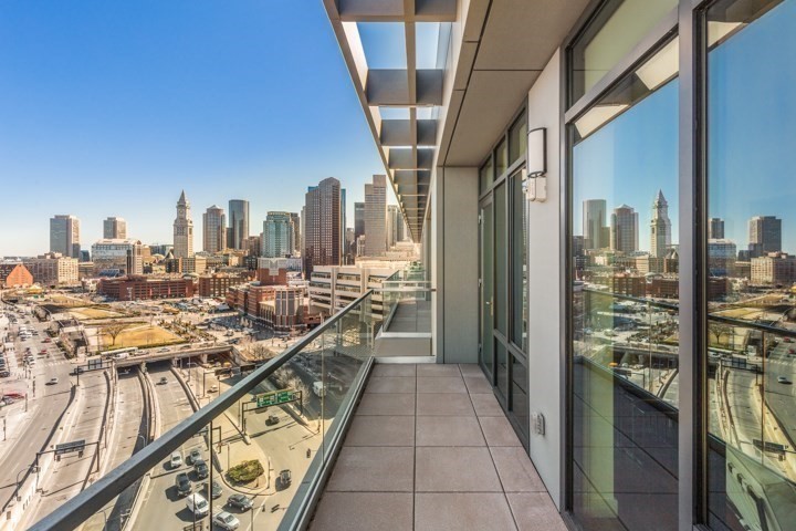 a view of a balcony with city view