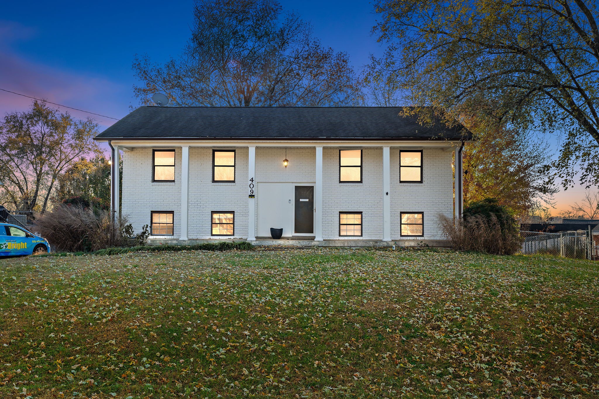 a front view of a house with a yard