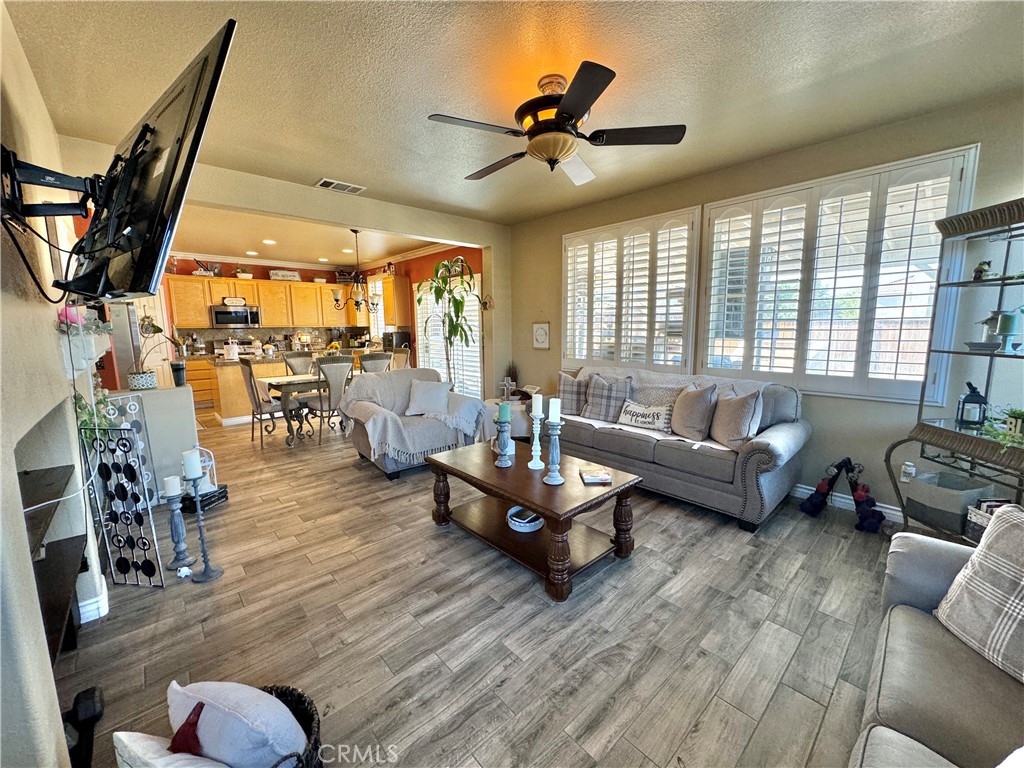 a living room with furniture or couch and a large window