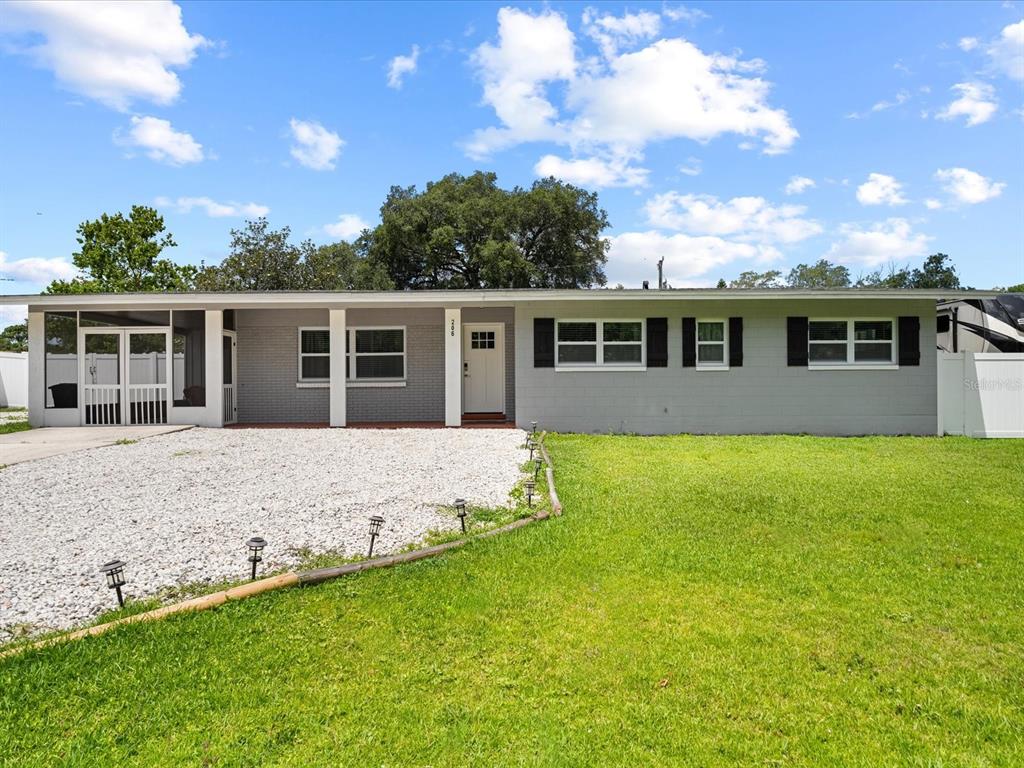 front view of a house with a yard