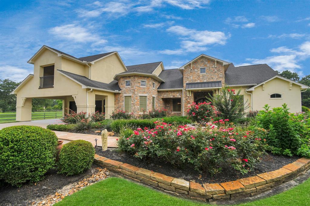 Welcome Home to this incredible luxury estate featuring 1.5 stories 4/5 bedrooms, 4 1/2 bathrooms, a fully heated/jetted pool on almost 1.4 acres. Home backs to Pecan Lake.