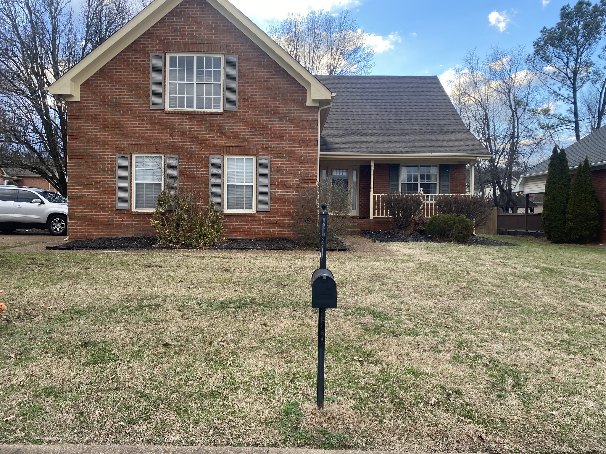 a front view of a house with garden