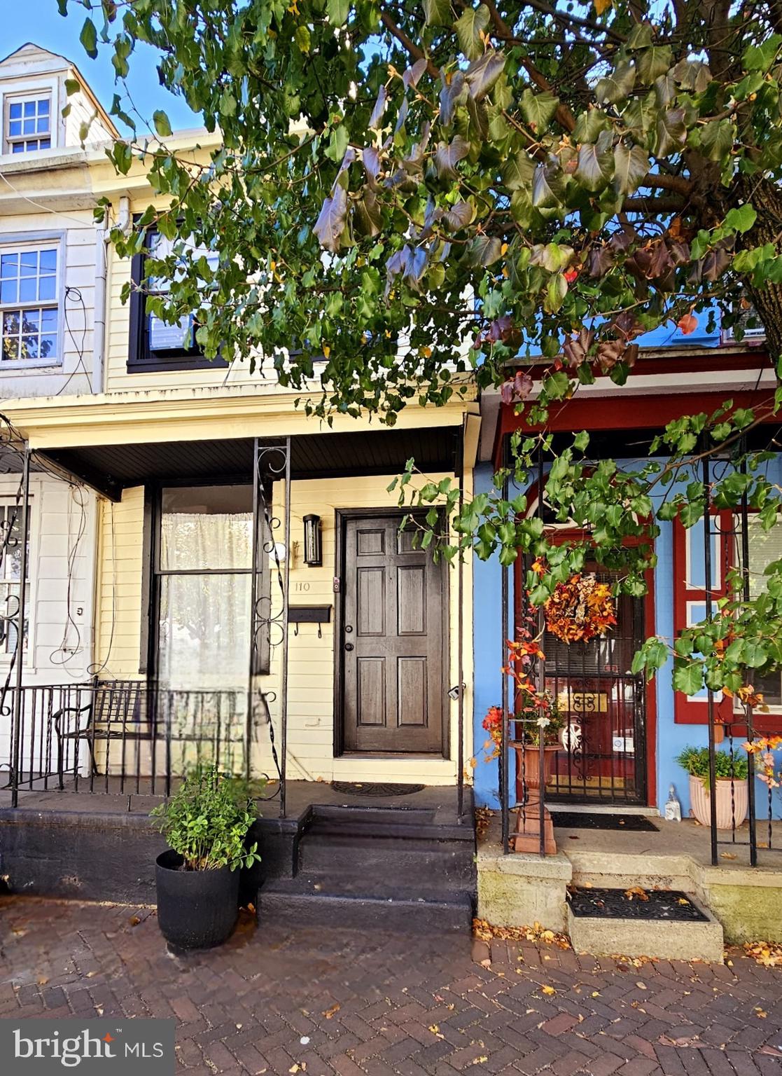 a front view of a building with a porch