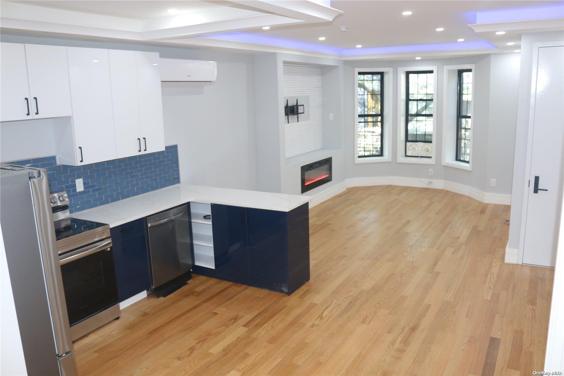 a kitchen with stainless steel appliances kitchen island wooden cabinets and granite counter tops