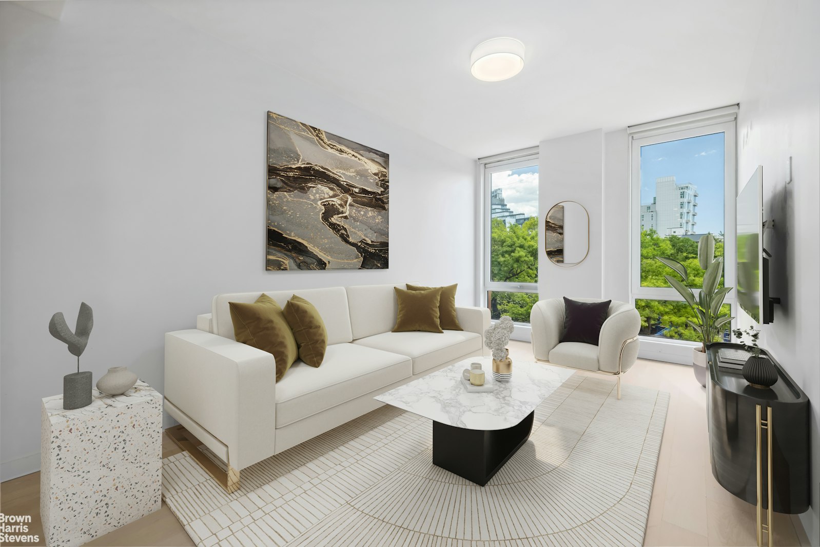 a living room with furniture and a flat screen tv