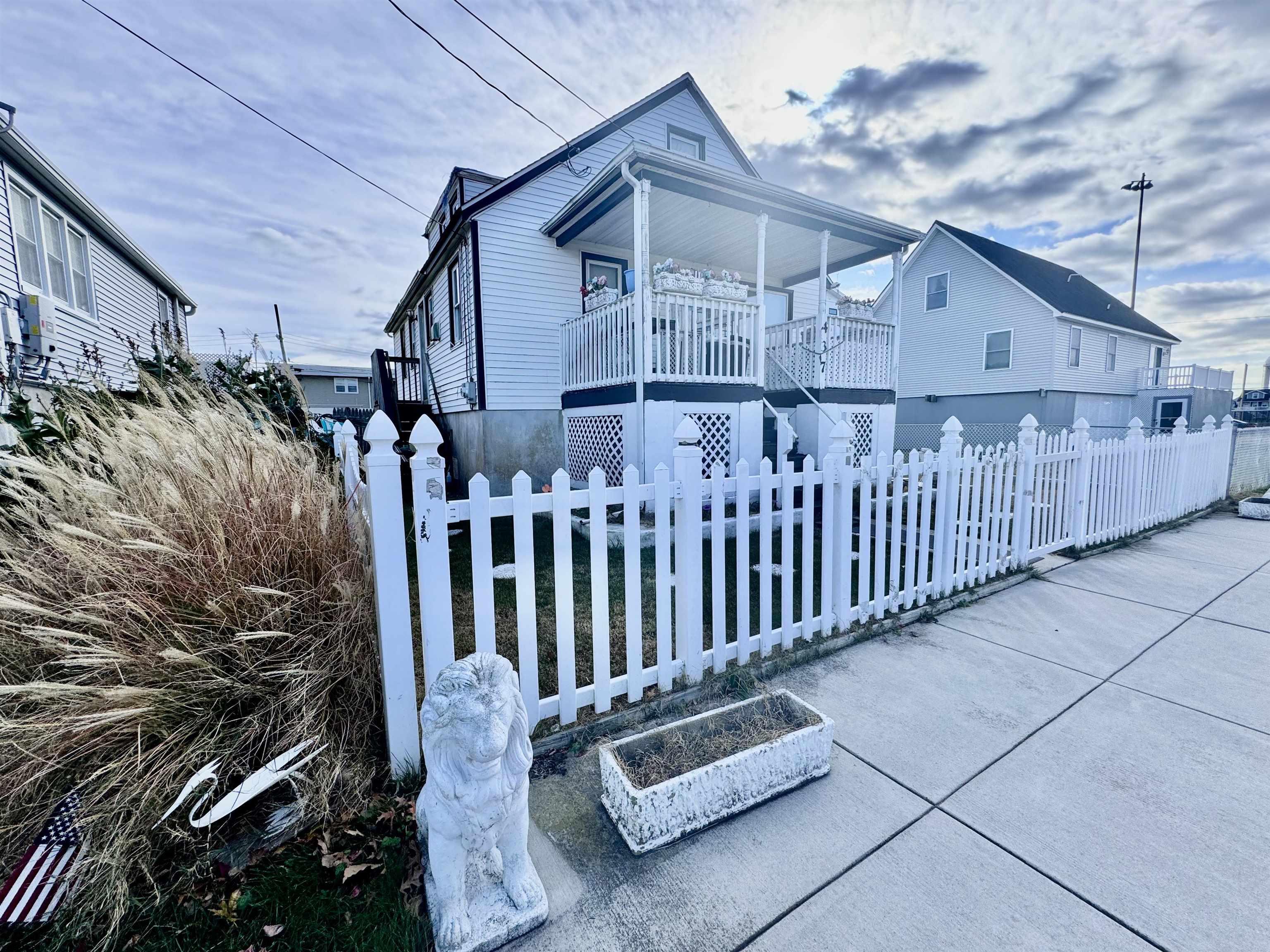 a view of a house with wooden fence