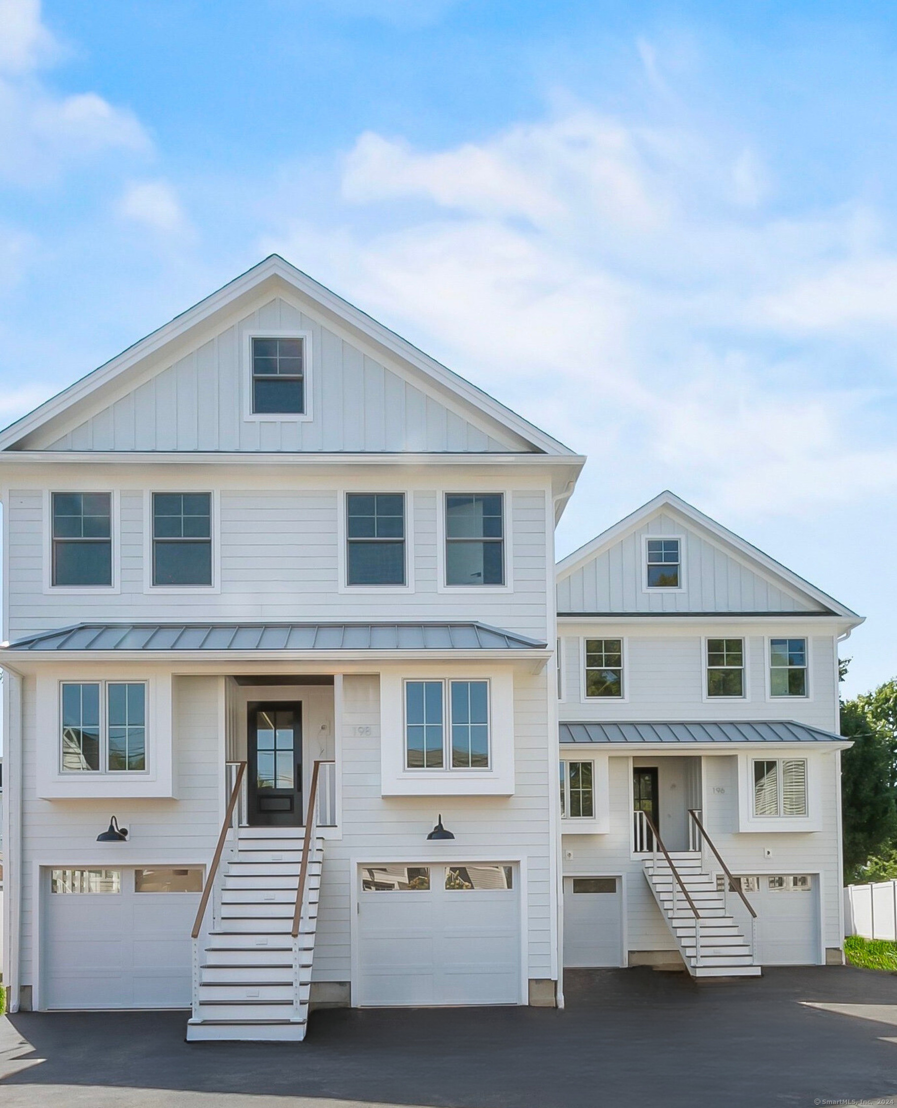 a front view of a house with a garage