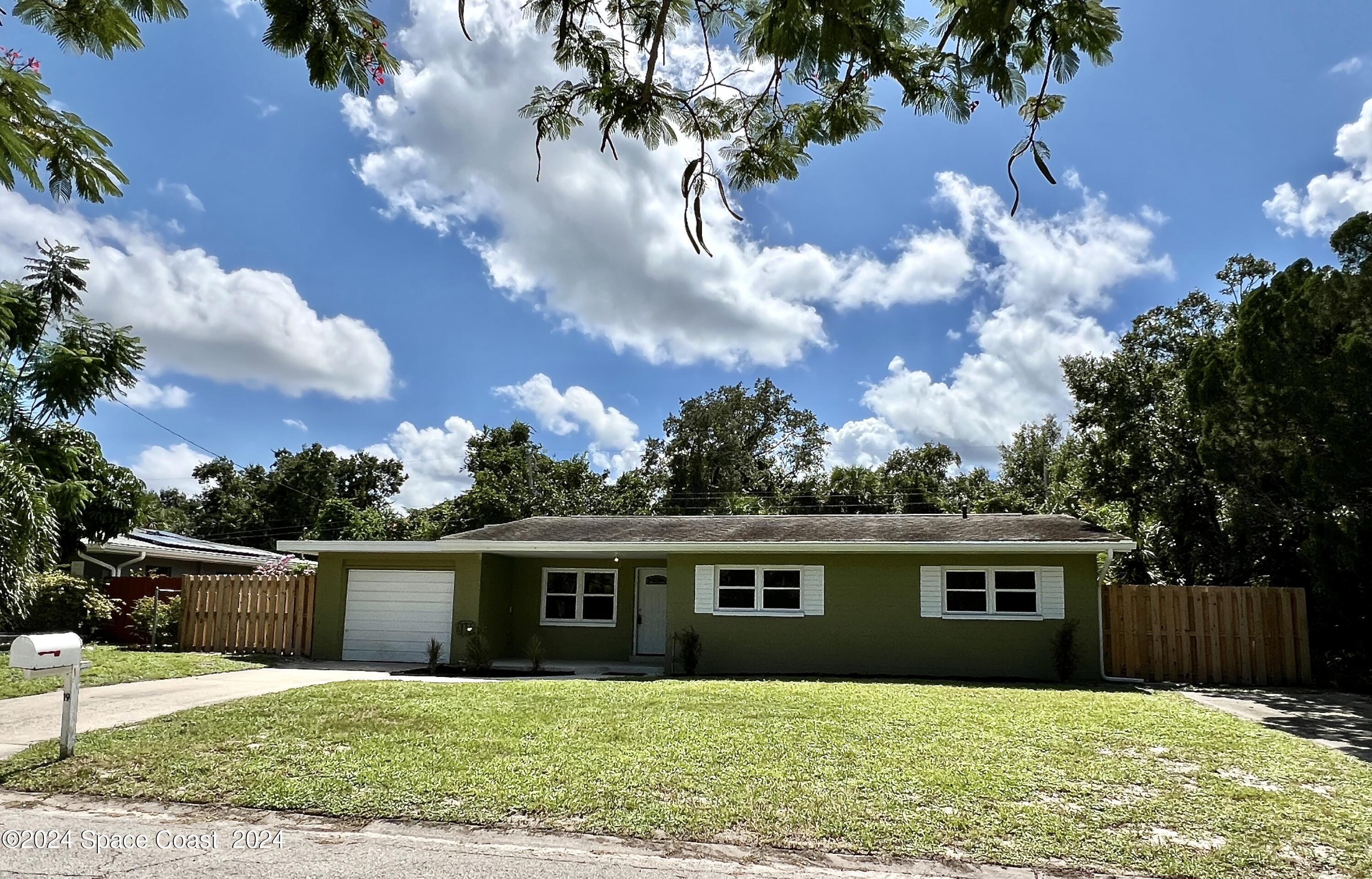 front view of a house with a yard