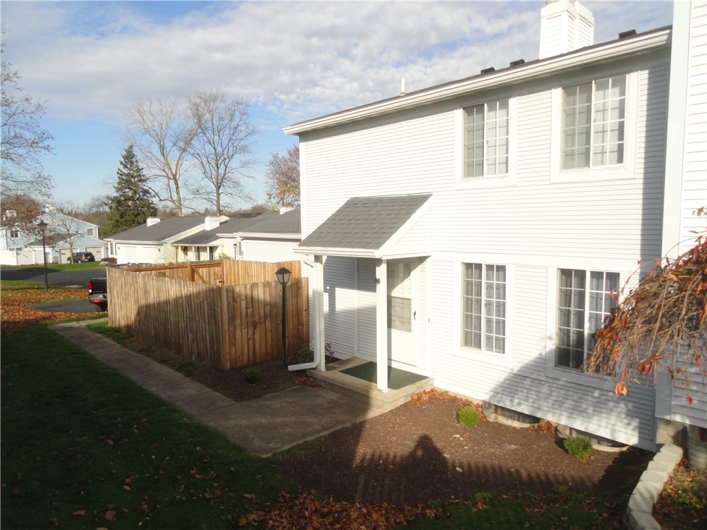 Covered front entry.  Private patio area