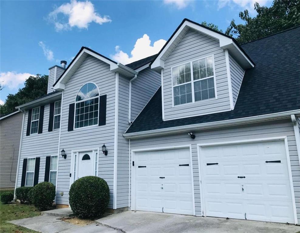 a view of a house with garage