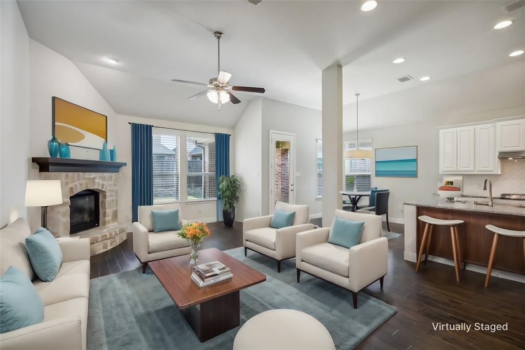 a living room with furniture fireplace and a flat screen tv