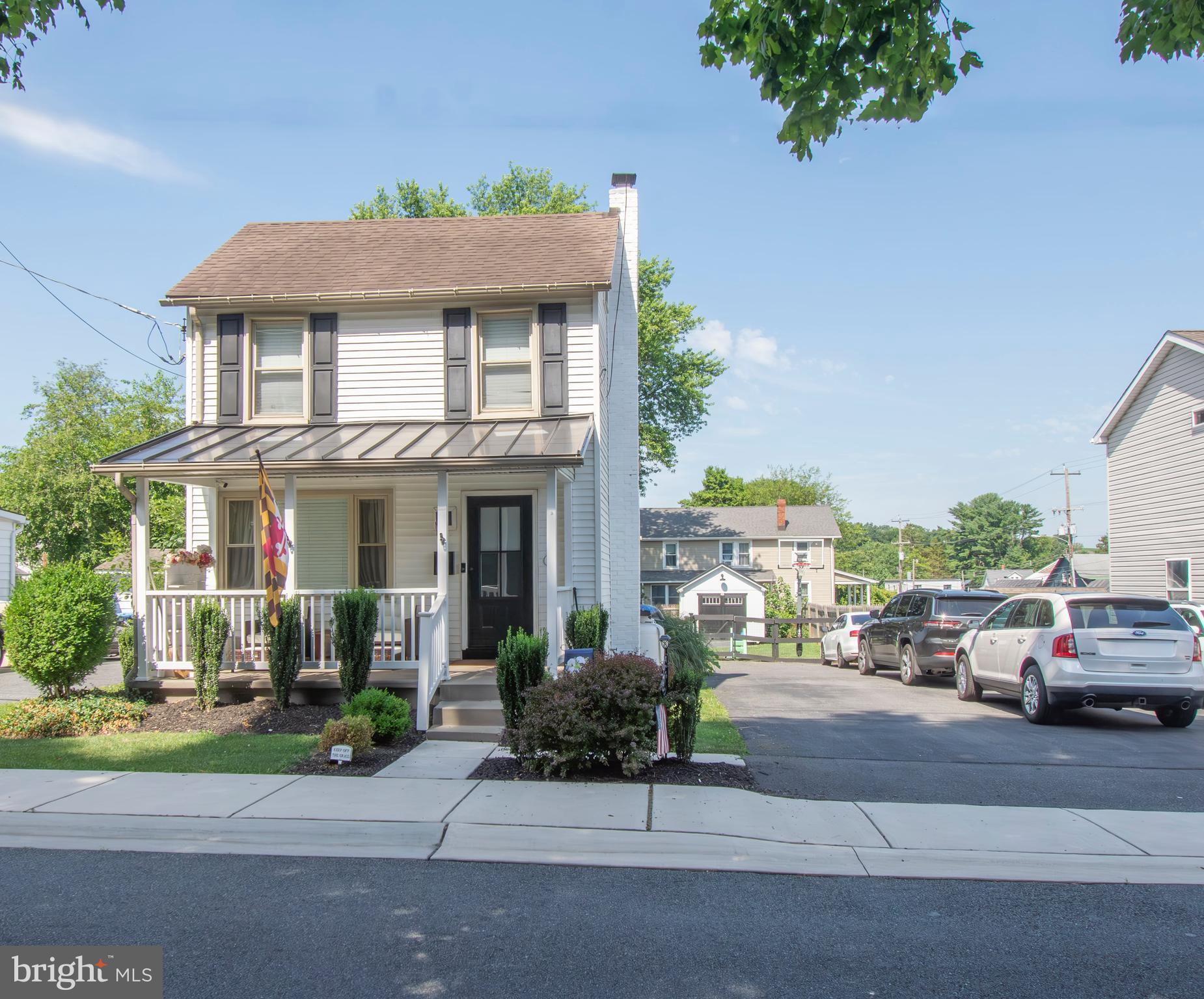 a view of multiple houses with a street