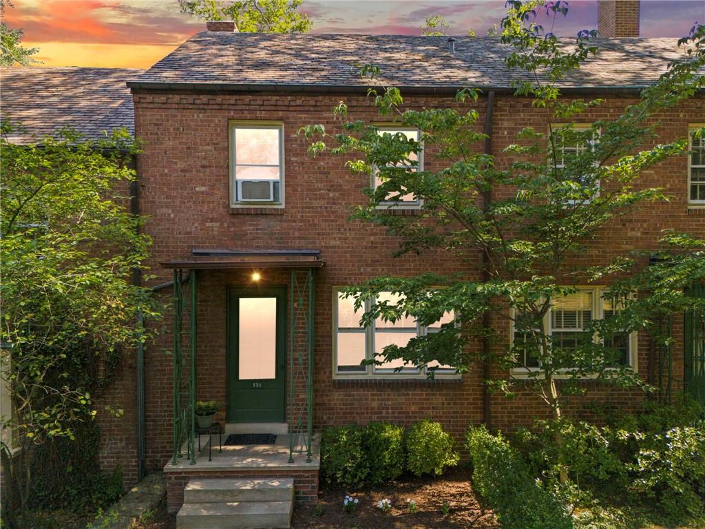 a front view of a house with lake view