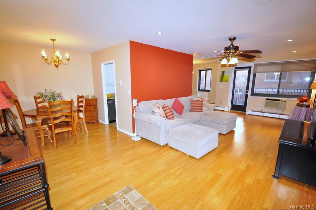 a bedroom with a bed lamps and chairs