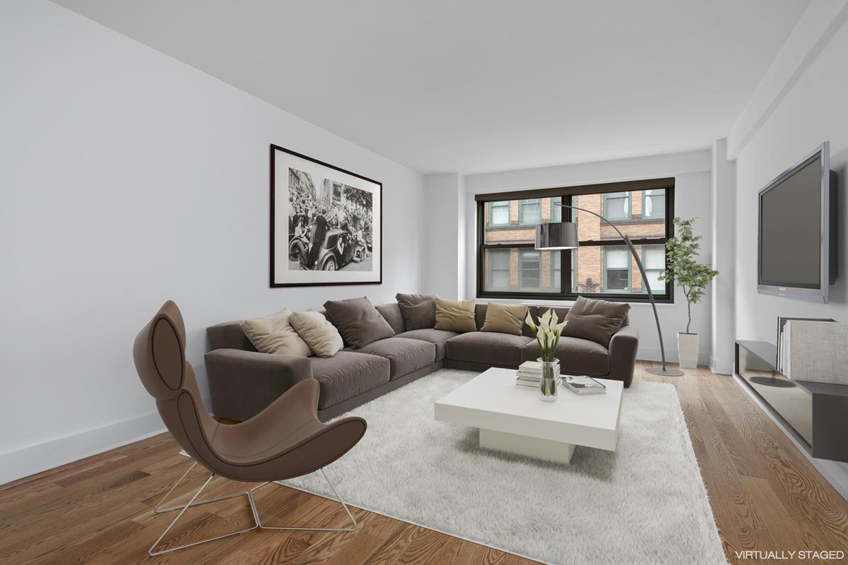 a living room with furniture two night stand and a flat screen tv