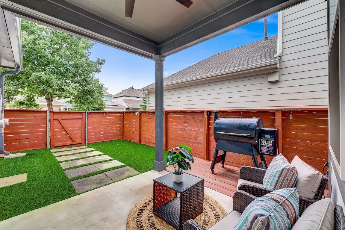 Adorable back porch with no maintenance turf