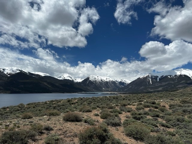 Property view of mountains with a water view