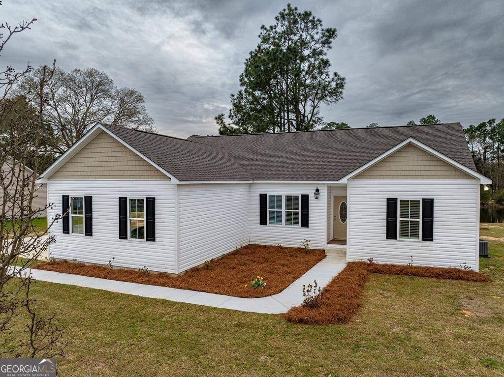 a house with trees in the background