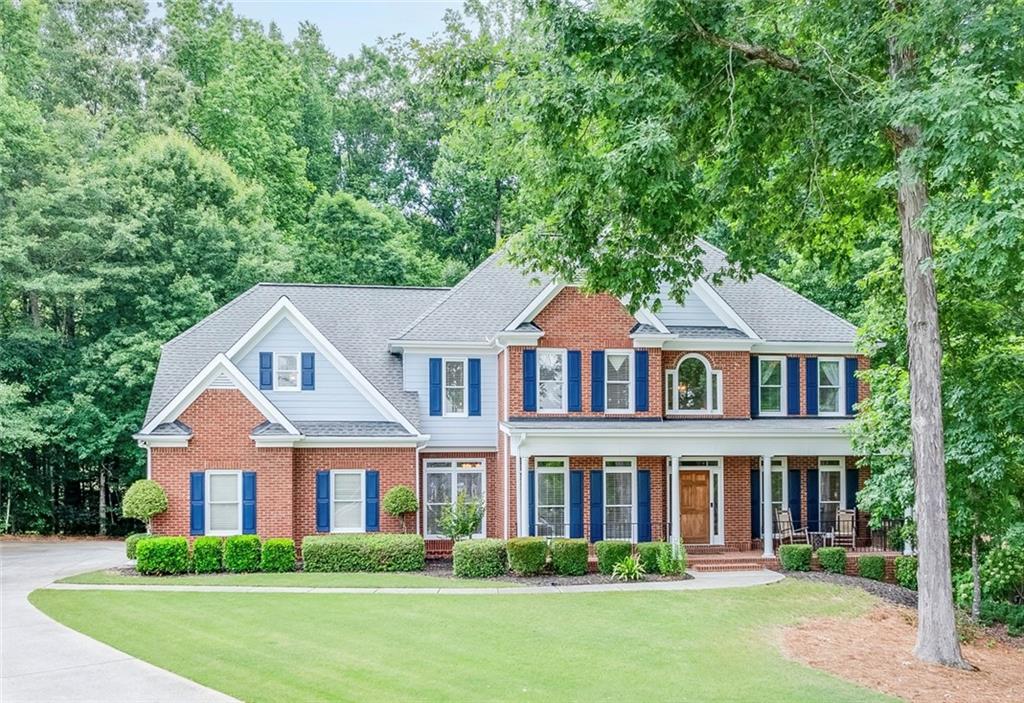 front view of a house with a yard