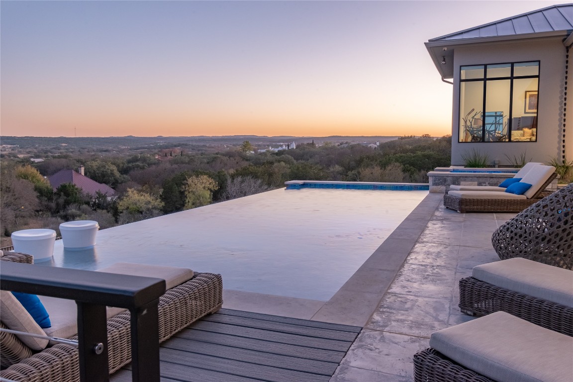 a terrace with outdoor seating and city view