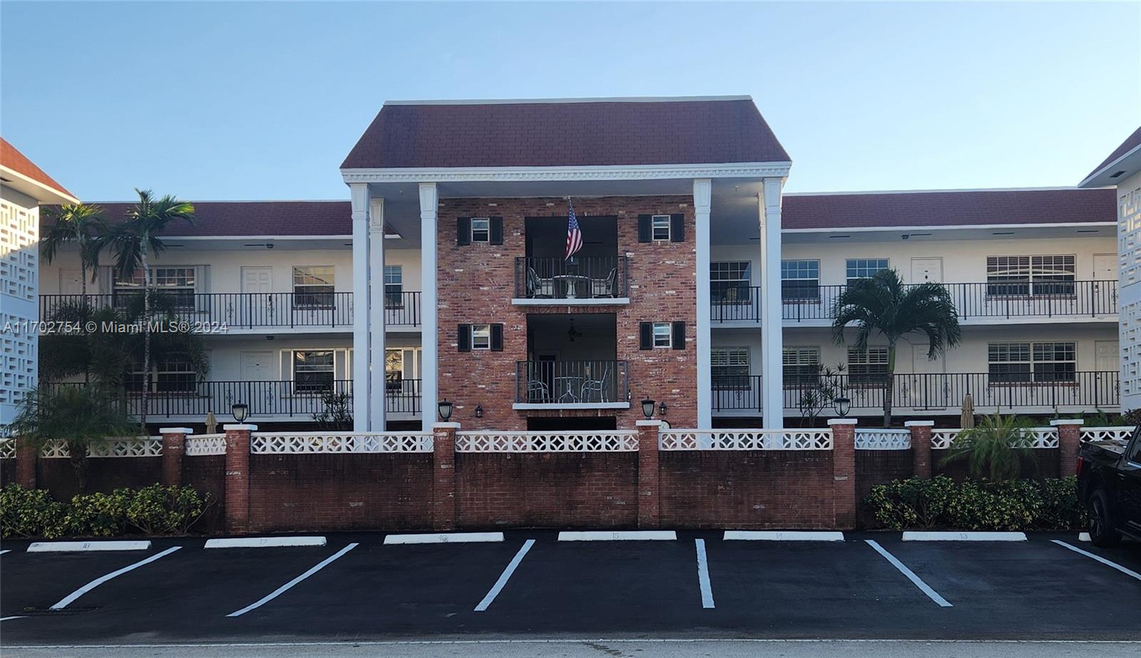 a front view of building with street