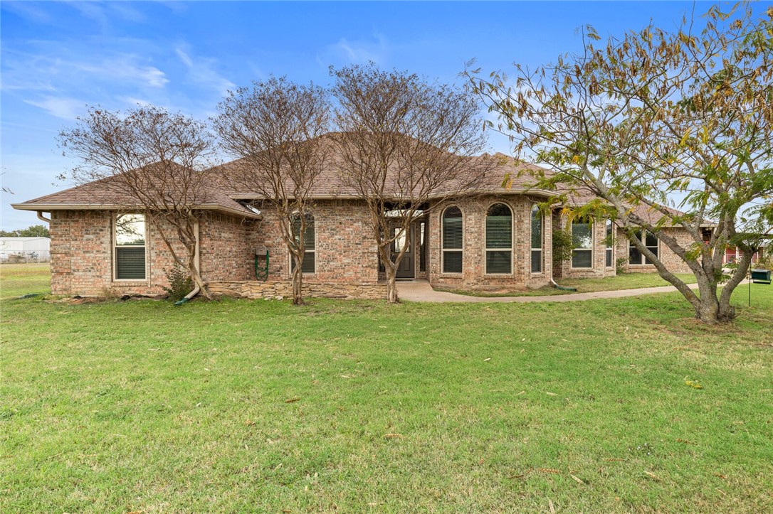 front view of a house with a big yard