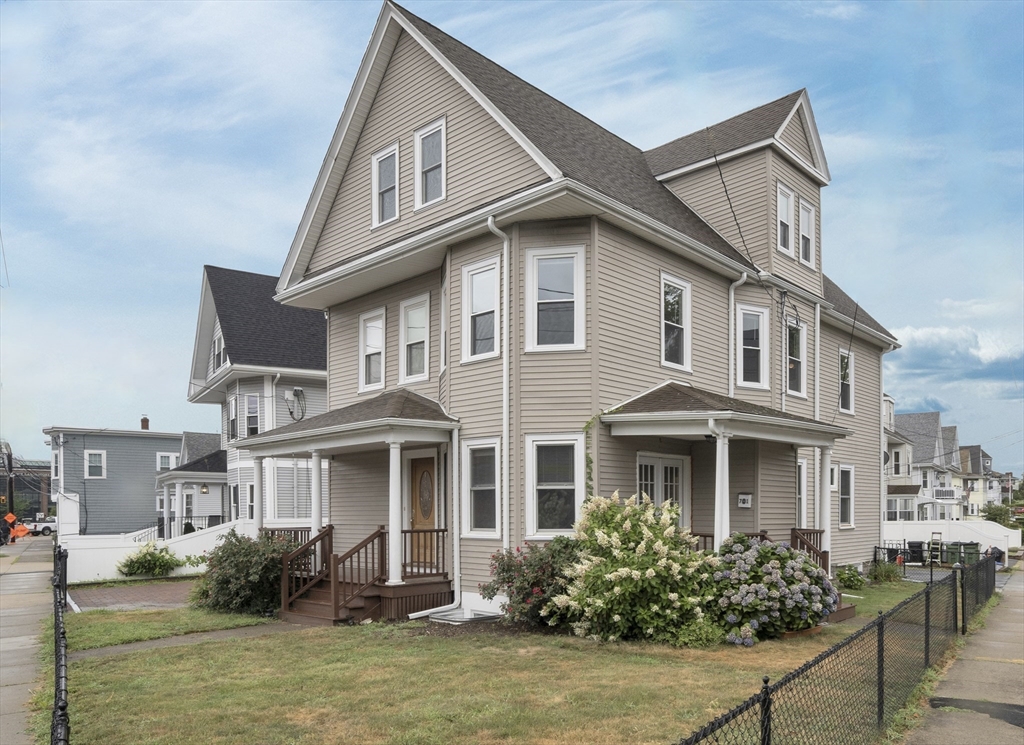 a front view of a house with lots of garden