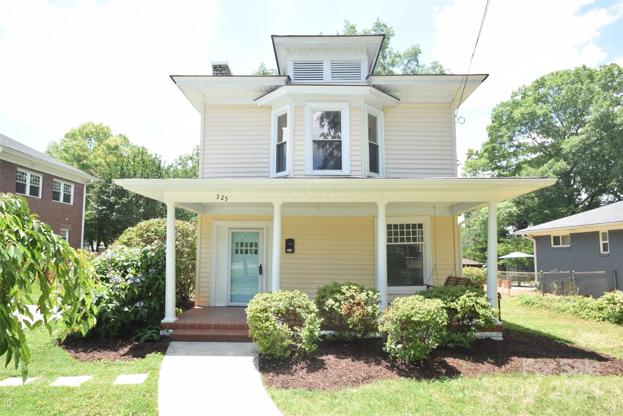 front view of a house with a yard