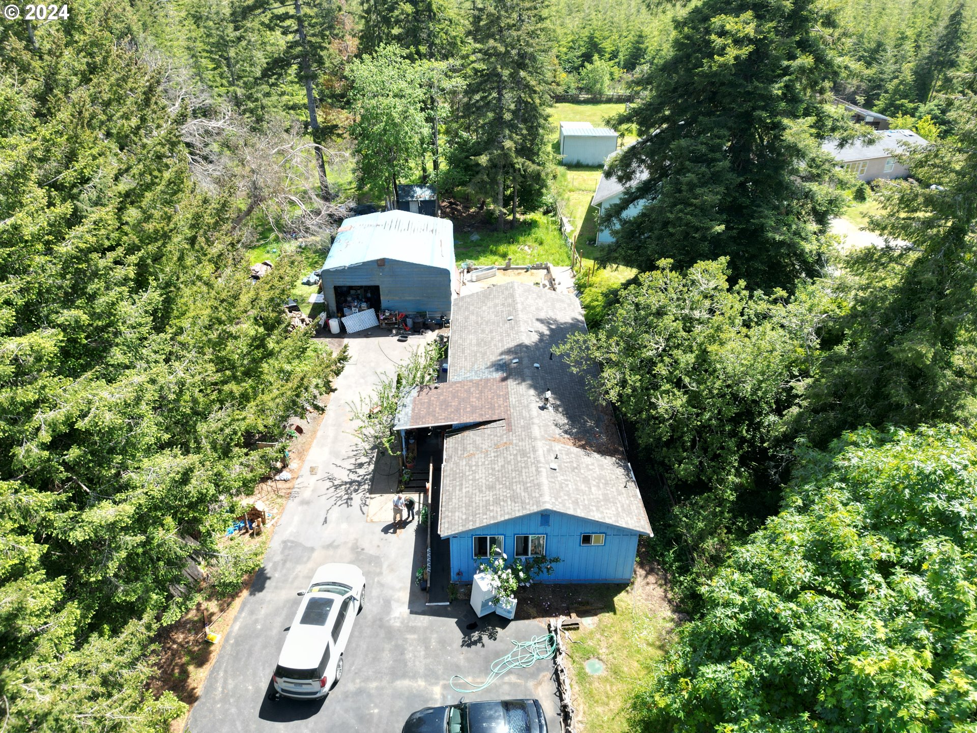 an aerial view of a house with outdoor space