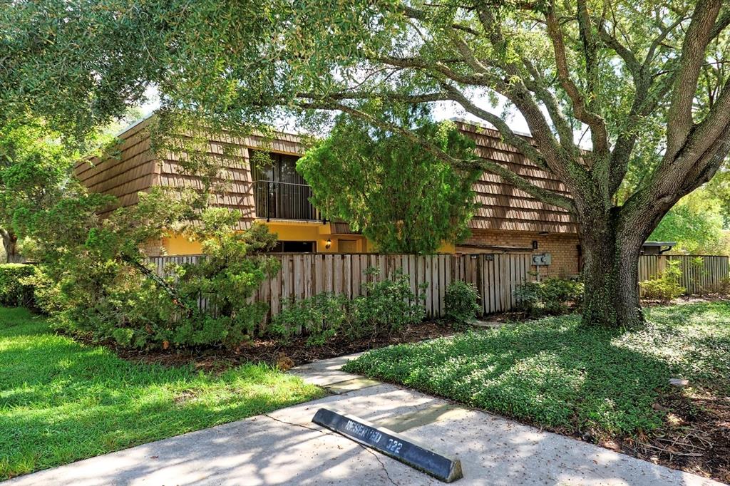 a view of a pathway of a house with a yard