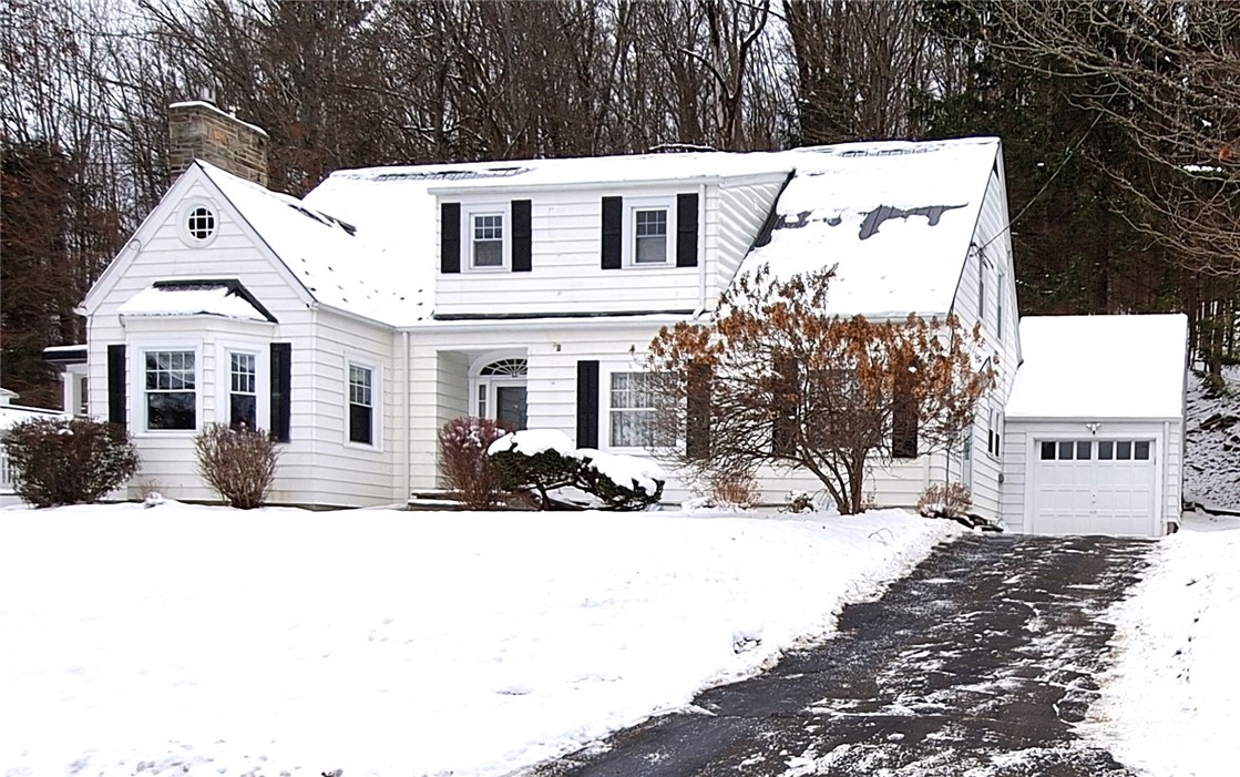 Well-maintained Cape Cod with Vinyl siding, blackt